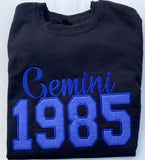 Custom embroidered zodiac sign and year.